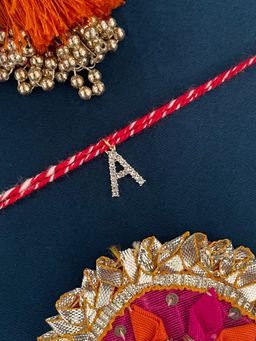 Digital Dress Room - A Letter Gold Plated Ad Stone Initial Charm Rakhi