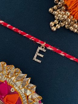 Digital Dress Room - E Letter Gold Plated Ad Stone Initial Charm Rakhi