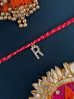Digital Dress Room - R Letter Gold Plated Ad Stone Initial Charm Rakhi