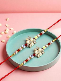 ADIVA - Pack Of 2 Floral Cz Stone & Beads Thread Rakhi With Thali Roli Chawal Bag Gift Set