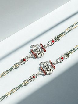 ADIVA - Pack Of 2 Silver Lord Krishna Stone Thread Rakhi With Thali Roli Chawal Bag Gift Set