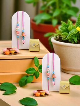 ADIVA - Pack Of 2 Beads & Pearls Floral Thread Lumba Rakhi With Thali Roli Chawal Bag Gift Set