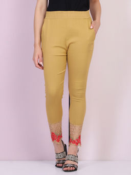 Buynewtrend - Women Cotton Silk Beige Solid Skinny Leggings
