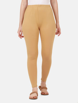 Buynewtrend - Women Cotton Beige Solid Skinny Leggings