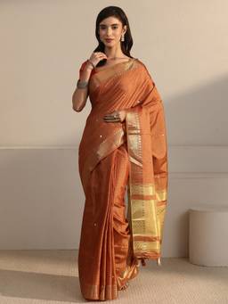 Libas - Rust Self Design Saree With Woven Design Border and Blouse Piece