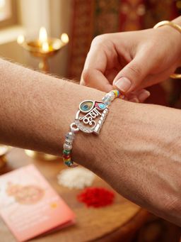 LUCKY JEWELLERY - Spiritual Silver Krishna Bansuri Beaded Rakhi For Brother With Roli Chawal and Card