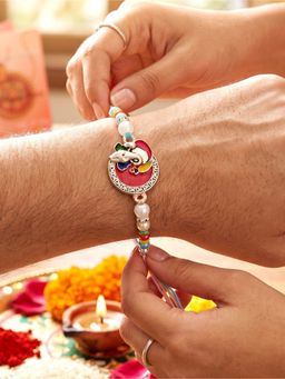 LUCKY JEWELLERY - Lord Ganesha Circular Ganpati Silver-Finish Enamel Beaded Rakhi Set For Brother