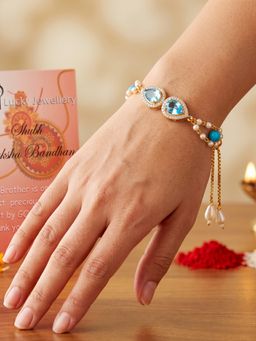 LUCKY JEWELLERY - Adjustable Rakhi Bracelet with Blue Drop Ad Pendant with Roli Chawal