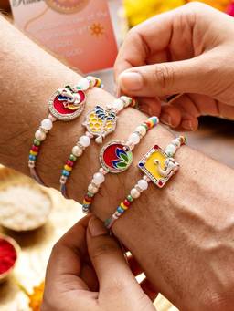 LUCKY JEWELLERY - Silver-Toned Enamel Ganesha and Floral Rakhi Combo for Brother (Pack of 4)