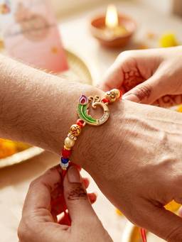 LUCKY JEWELLERY - Peacock Spiritual Beaded Rakhi For Brother With Roli Chawal and Card