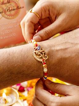 LUCKY JEWELLERY - Spiritual Om Krishna Flute Peacock Beaded Rakhi Set For Brother Roli Chawal and Card