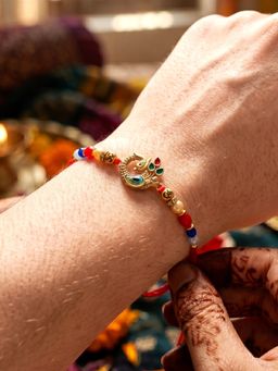 LUCKY JEWELLERY - Elegant Peacock Enamel Beaded Rakhi for Brother with Roli Chawal and Card