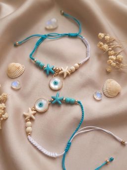 NVR - Chandan Blue Evil Eye & White Pearl Bhaiya Bhabhi Rakhis (Pack of 2)