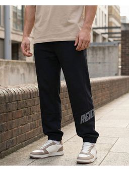 Bewakoof - Men Jet Black Reignite Typography Oversized Joggers