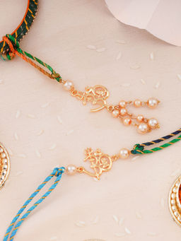 Estele - Gold Plated Om Rakhi for Bhaiya Bhabhi with Pearls & Multi Coloured Silk Thread