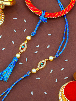 Estele - Gold Plated Evil Eye Bhaiya Bhabhi Rakhi with Fancy Silk Thread