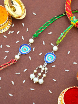 Estele - Gold Plated Evil Eye Bhaiya Bhabhi Rakhi with Fancy Silk Thread