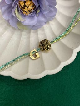 Digital Dress Room - Letter G Lion Charm Thread Rakhi