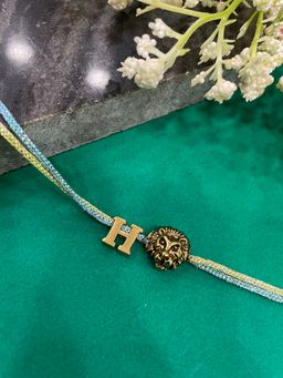 Digital Dress Room - Letter H Lion Charm Thread Rakhi