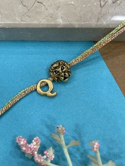 Digital Dress Room - Letter Q Lion Charm Thread Rakhi