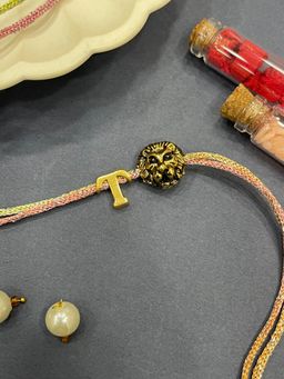 Digital Dress Room - Letter T Lion Charm Thread Rakhi