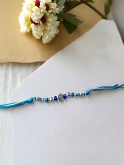 Accessher - Blue Rakhi with Smiley Face Gifting with Roli Kumkum Packets & Raksha Bandhan Card