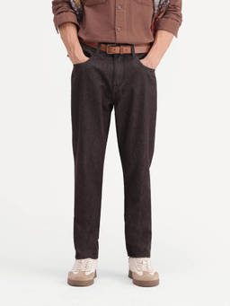 Rare Rabbit - Men Carrot Fit Fluorescent Brown Solid Cotton Jeans