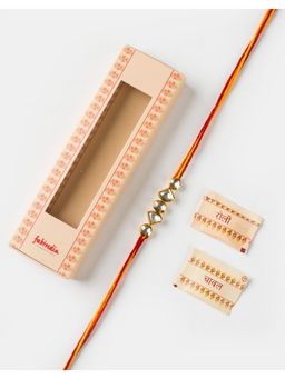 Fabindia - Women White Kundan Thread Rakhi with Roli Chawal