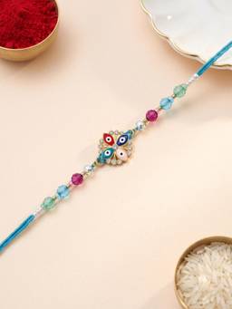 ADIVA - Handmade Evil Eye Floral Thread Rakhi with Roli Chawal-Chandan-Mishri and Card