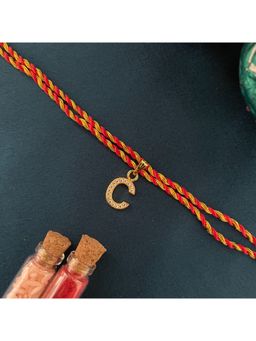 Digital Dress Room - Gold C Letter Ad Red Thread Rakhi