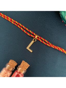 Digital Dress Room - Gold L Letter Ad Red Thread Rakhi