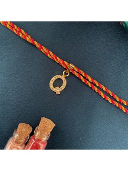 Digital Dress Room - Gold Q Letter Ad Red Thread Rakhi