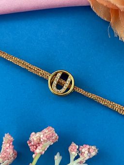 Digital Dress Room - Gold U Letter Round Ad Thread Rakhi