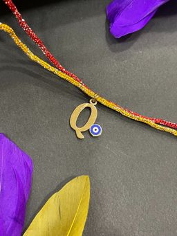 Digital Dress Room - Gold Q Letter Evil Eye Thread Rakhi