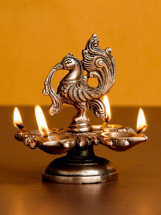 eCraftIndia Decorative Handcrafted Peacock Brass Showpiece with Diya for 4 Wicks