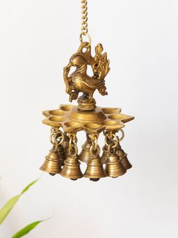 ExclusiveLane - Peacock Bliss Hand-Etched Hanging Diya with Bell In Brass (9 Diyas & Bells, 983 Grams)