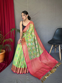 EXCLUSIVA - Green Tissue Silk Woven Saree with Unstitched Blouse