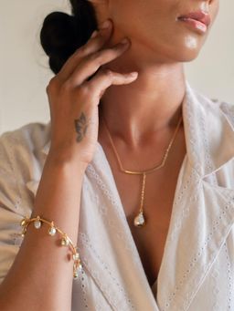 Dhwani Bansal - Ona Pendant With Single Gold Dipped Pearl Against A Gold Plated Brass Adjustable Chain