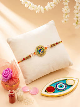 ADIVA - Lord Krishna Peacock Thread Rakhi with Roli Chawal and Evil Eye Plate Tokri Gift Set