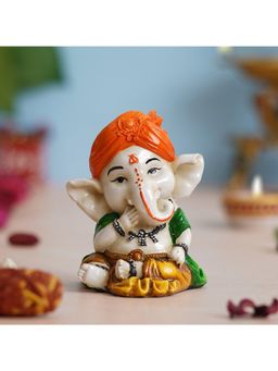 eCraftIndia - Orange Polyresin Handcrafted Eating Lord Ganesha Idol while Sitting