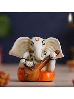 eCraftIndia - White & Orange Polyresin Handcrafted Lord Ganesha Idol Playing Veena