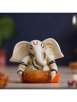eCraftIndia - White & Orange Handcrafted Lord Ganesha Idol Playing Dholak Musical Instrument