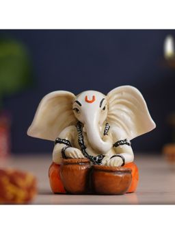 eCraftIndia - White & Orange Handcrafted Lord Ganesha Idol Playing Tabla Musical Instrument