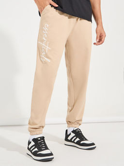 Styli - Men Beige Relaxed Fit Typography Joggers with Slant Pocket