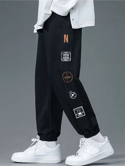 Nobero - Men Black Text Travel Stamp Joggers