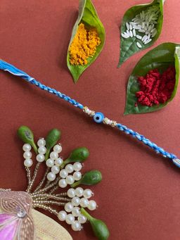 Digital Dress Room - Unique Fancy Rakhi Light Blue Evil Eye Charm Moti Thread Rakhi