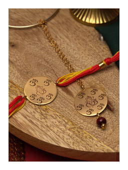 Suhani Pittie - Mutiple Om 22K Gold Plated Rakhi With Red And Yellow Tieups & Lumba Rakhi Set