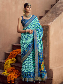 Elora - Soft Silk Ikat Printed Turquoise Saree With Unstitched Blouse