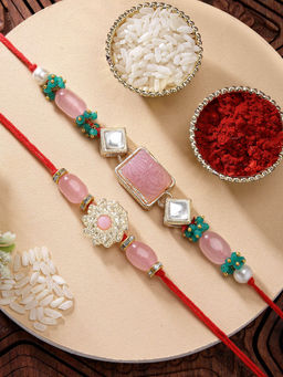 Karatcart - Set Of 2 Carved Stone Floral Kundan Rakhi with Roli Chawal