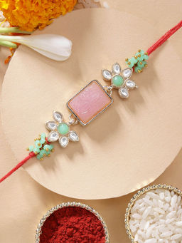 Karatcart - Beautifully Carved Stone Crystal Rakhi with Roli Chawal